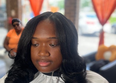 Beautiful woman with styled hair at Luxury Hair Therapy, Chicago Ridge, Illinois, US.