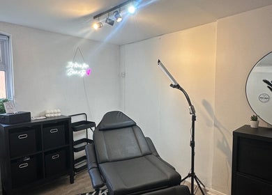 Modern treatment room at Pure Nine Beauty (Harborne), Birmingham, England, GB, featuring sleek decor and equipment.
