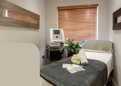 Cozy treatment room at Pure Nine Beauty, Birmingham, England, GB with a spa bed and decor for relaxation.