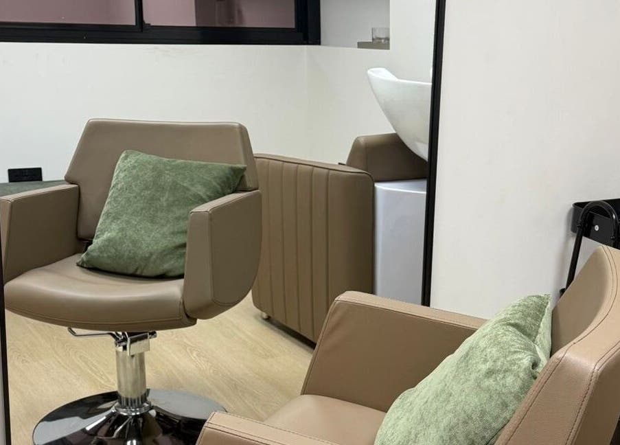 Relaxing styling chair at CHiLL CULT by Santana Lantuch, London, England, GB. Elegant and inviting salon interior.