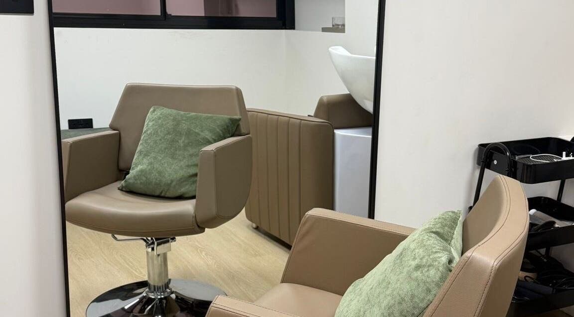 Relaxing styling chair at CHiLL CULT by Santana Lantuch, London, England, GB. Elegant and inviting salon interior.