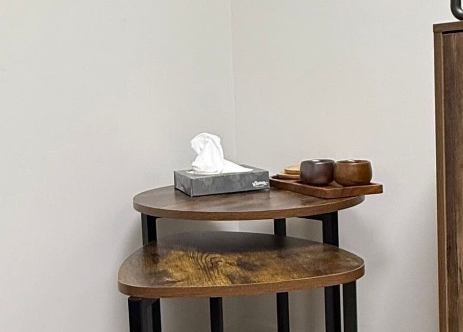 Wooden table with tissues and cups at CHiLL CULT by Santana Lantuch, London, England, GB.