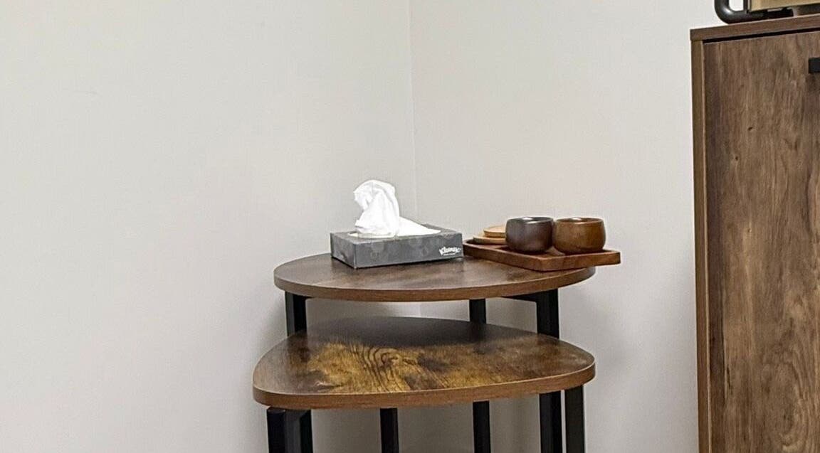 Wooden table with tissues and cups at CHiLL CULT by Santana Lantuch, London, England, GB.