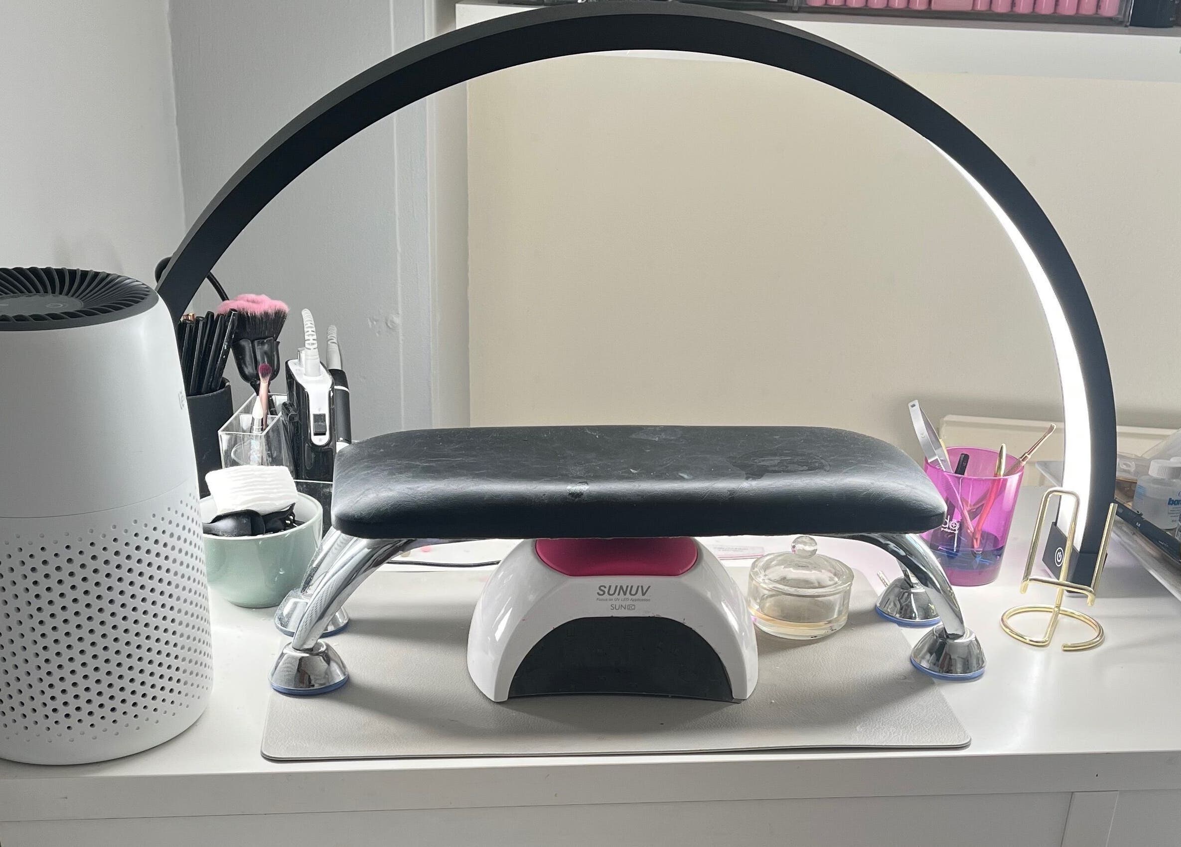 Modern nail station at Maison de Maya, Basildon, England, GB with manicure tools and LED lamp.