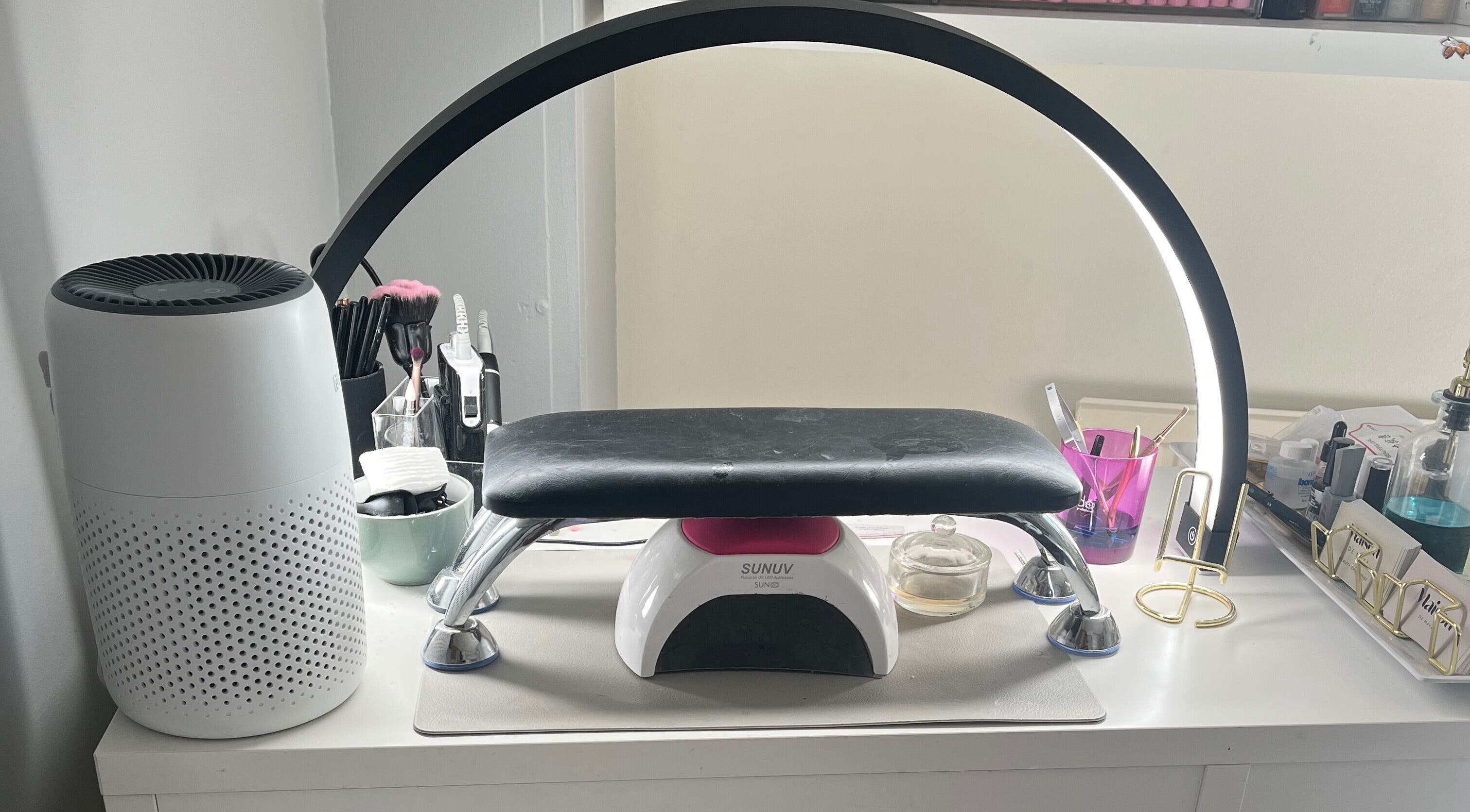 Modern nail station at Maison de Maya, Basildon, England, GB with manicure tools and LED lamp.