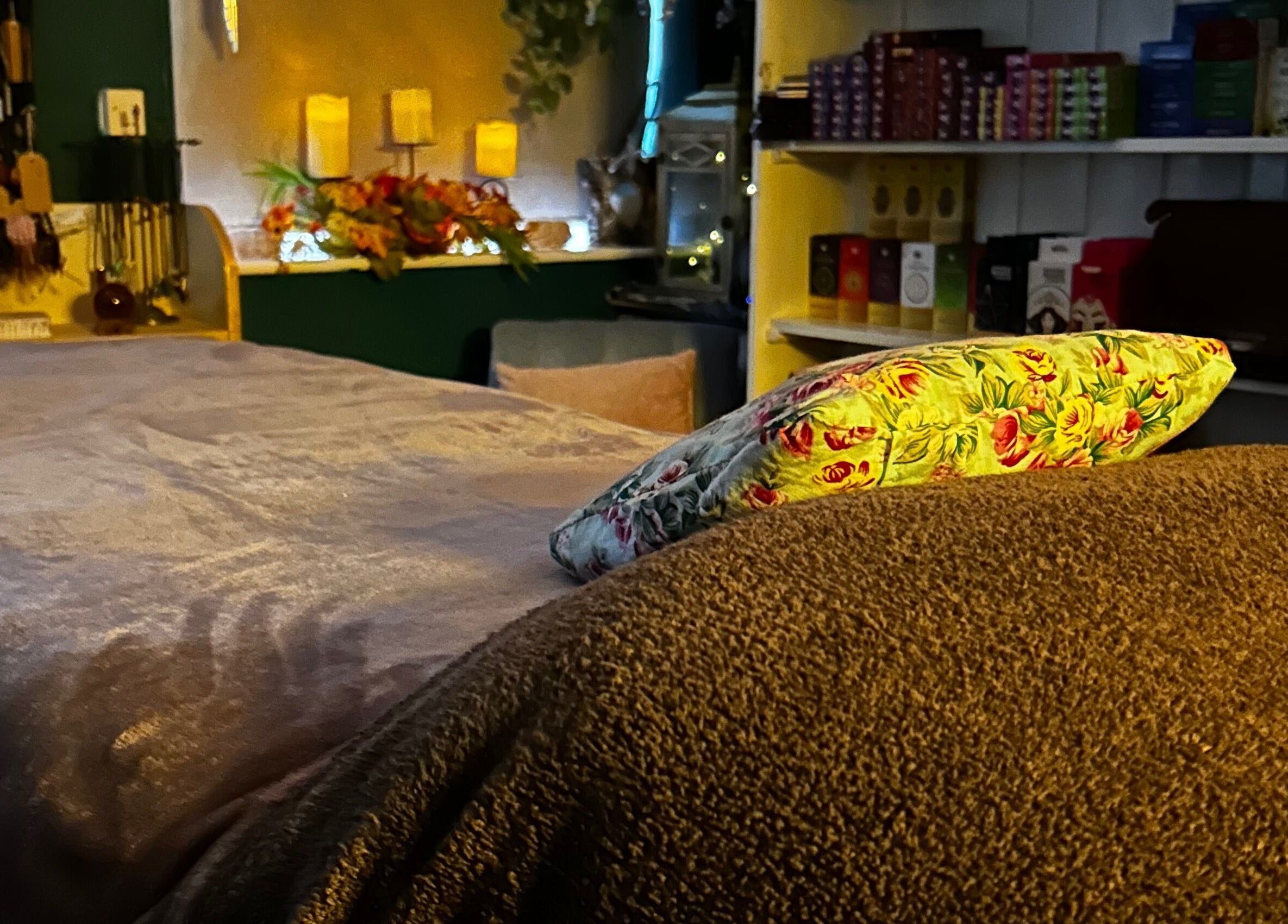 Relaxing treatment room at The Indigo Life, Rugeley, England, GB, featuring a plush massage bed and ambient decor.