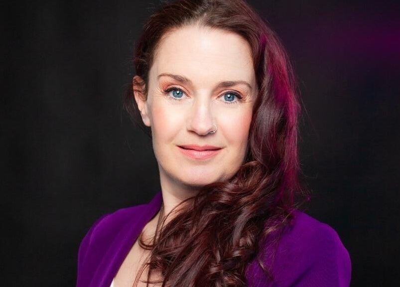 Smiling woman with purple attire at The Indigo Life, Rugeley, England, GB.