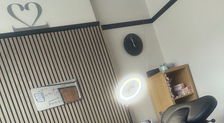 Interior of Twenty Two Beauty and Training studio in Ripley, England, featuring a chair and a well-lit workspace.