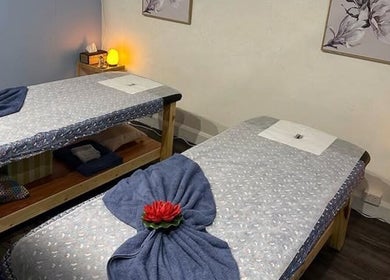 Peaceful massage room at 88 Thai Massage Studio, Richmond, Victoria, AU with two beds and soothing lighting.