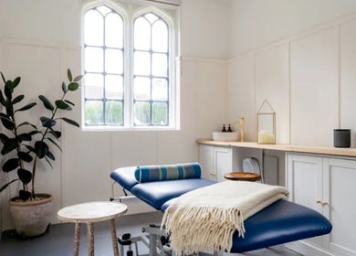 Comfortable massage room with blue bed at Rejuvenate by Janka, Hatfield, England, GB.