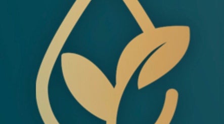 Elegant golden leaf logo of Rejuvenate by Janka, Hatfield, England, GB, on green background.