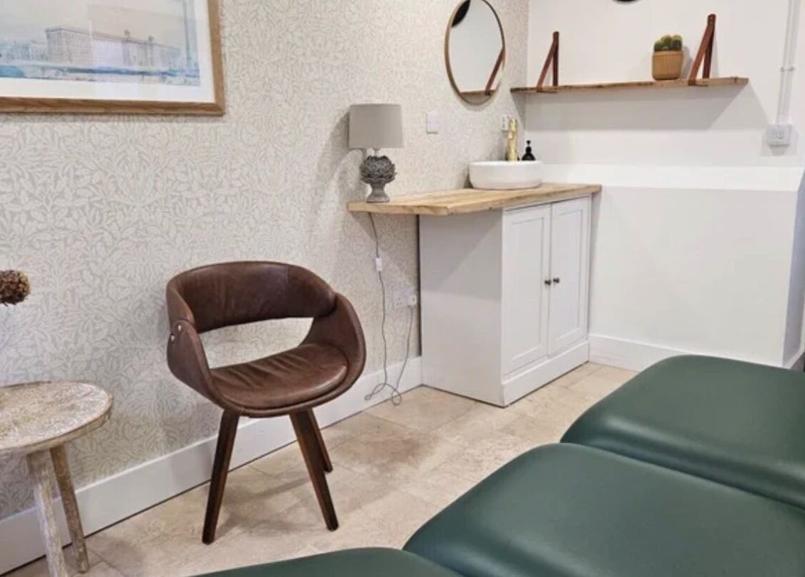 Elegant interior at Rejuvenate by Janka The Oak House studio, Hatfield, England, GB, featuring green massage beds and modern decor.