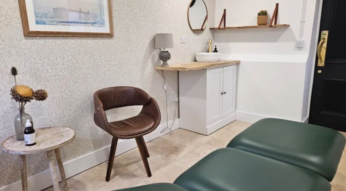 Elegant interior at Rejuvenate by Janka The Oak House studio, Hatfield, England, GB, featuring green massage beds and modern decor.