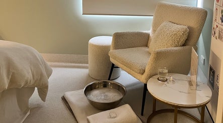 Relaxing therapy area at Exhale Holistic Skin, Bentleigh East, Victoria. Inviting chair and foot spa for clients.