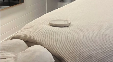Cozy treatment bed at Exhale Holistic Skin, Bentleigh East, Victoria, AU, inviting a tranquil spa experience.