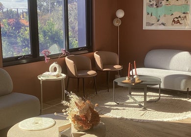 Warm, inviting lounge area at Exhale Holistic Skin, Bentleigh East, Victoria, AU with soft seating and natural light.