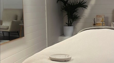 Relaxing treatment room at Exhale Holistic Skin, Bentleigh East, Victoria, AU with cozy chair and decor.
