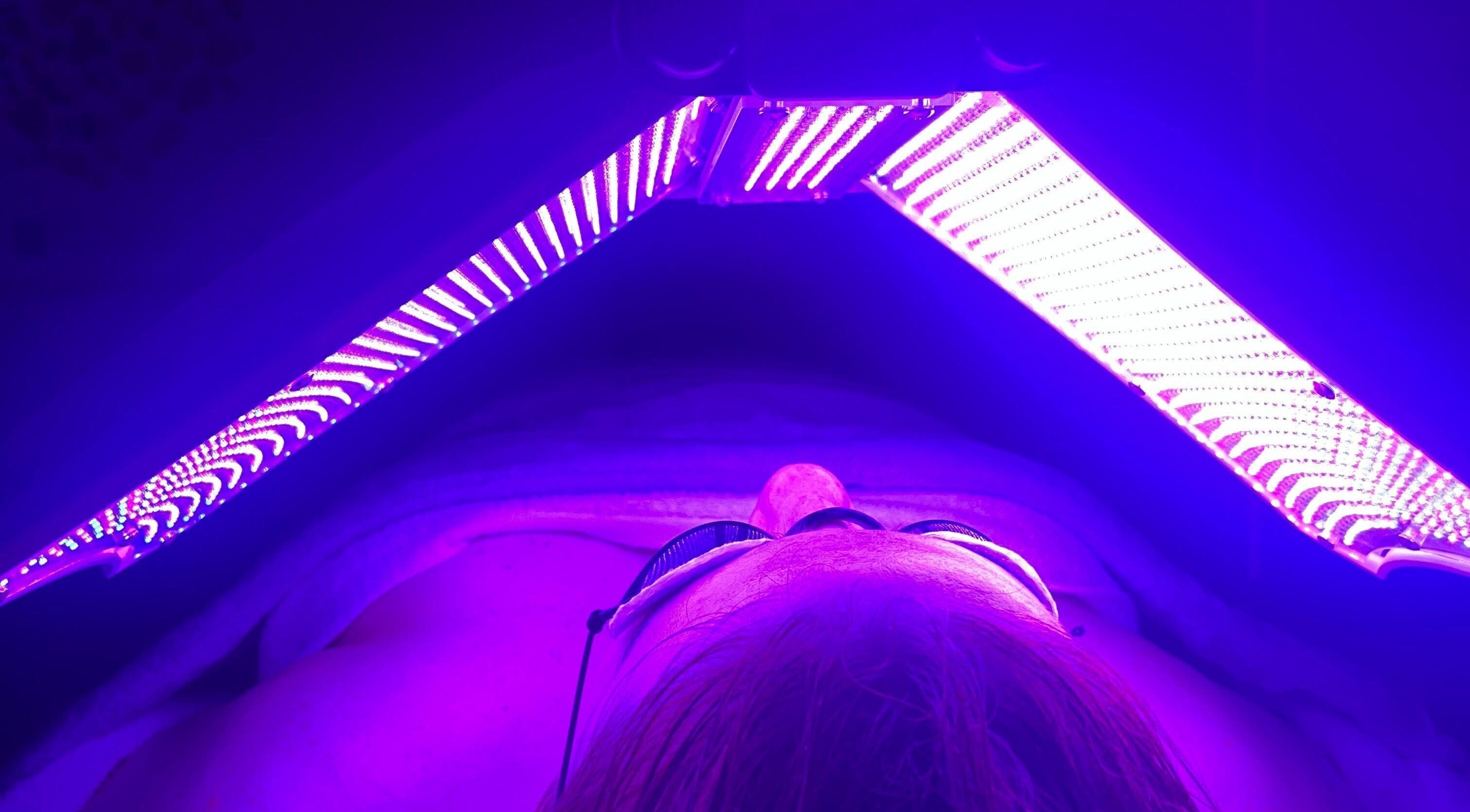 LED therapy session at Exhale Holistic Skin, Bentleigh East, Victoria, AU. Enhancing skin health under violet light.