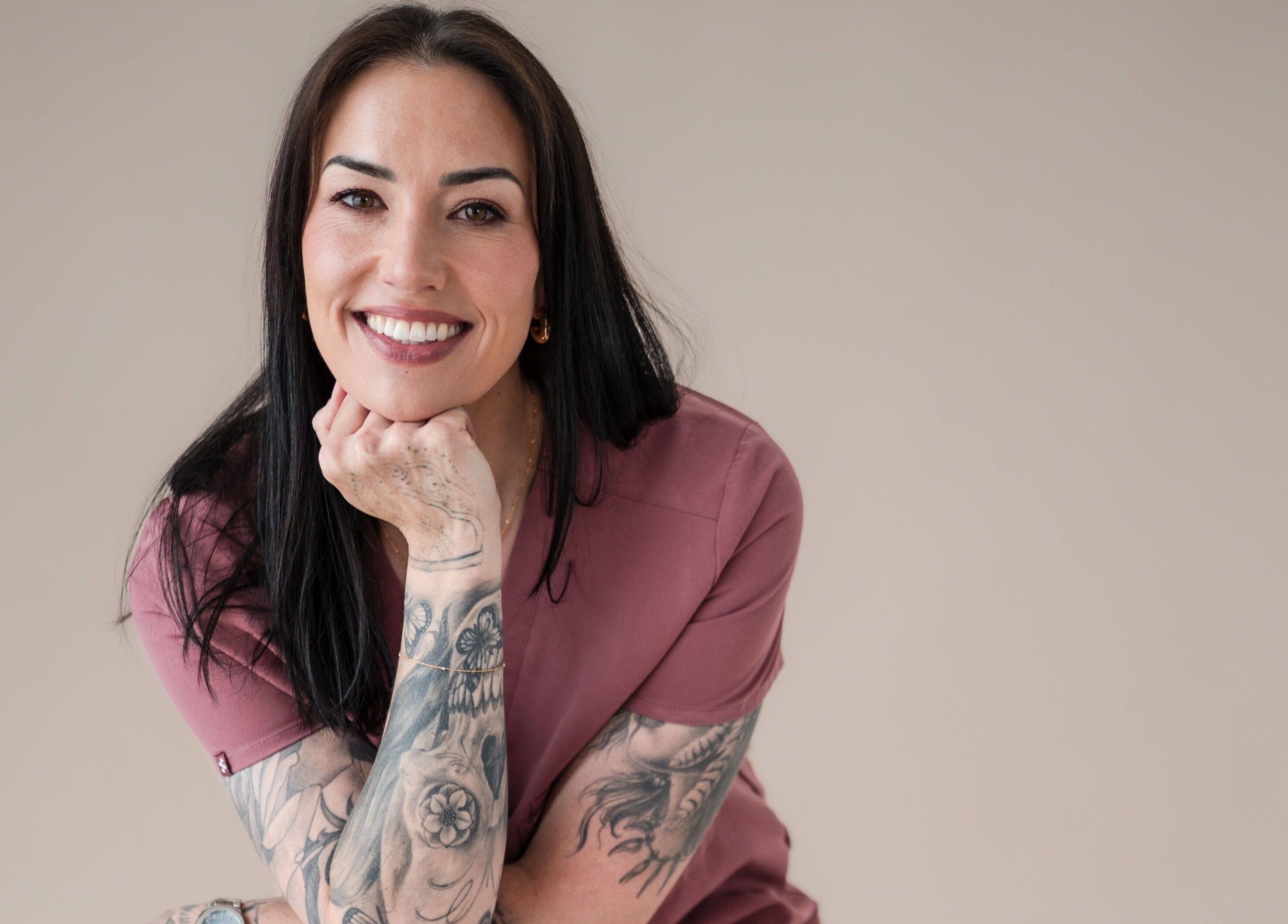 Friendly tattooed staff member at Exhale Holistic Skin, Bentleigh East, Victoria, AU, enhancing wellness.