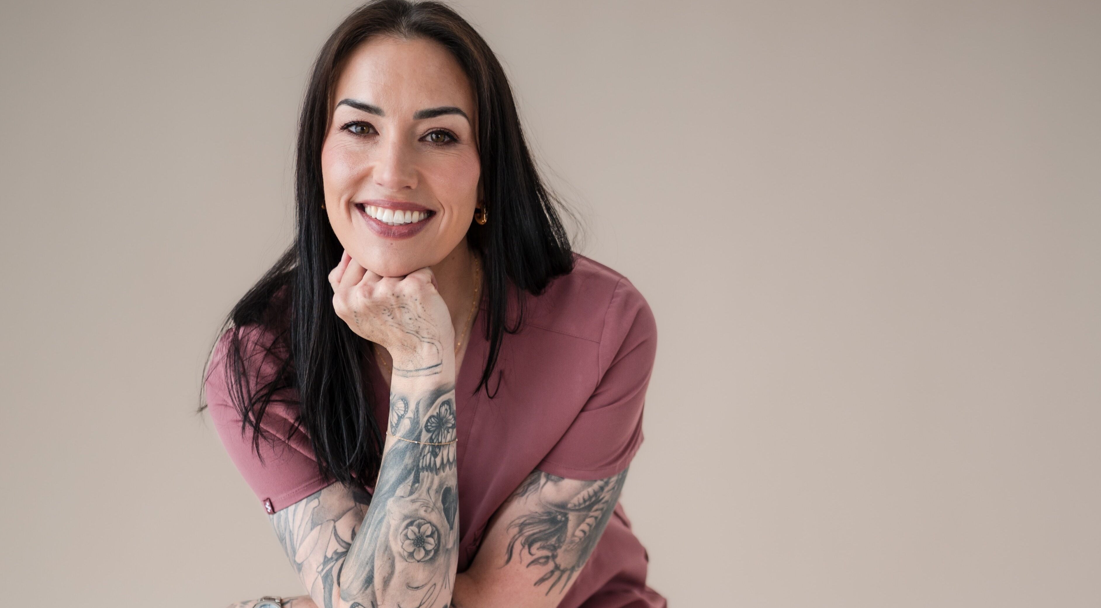 Friendly tattooed staff member at Exhale Holistic Skin, Bentleigh East, Victoria, AU, enhancing wellness.