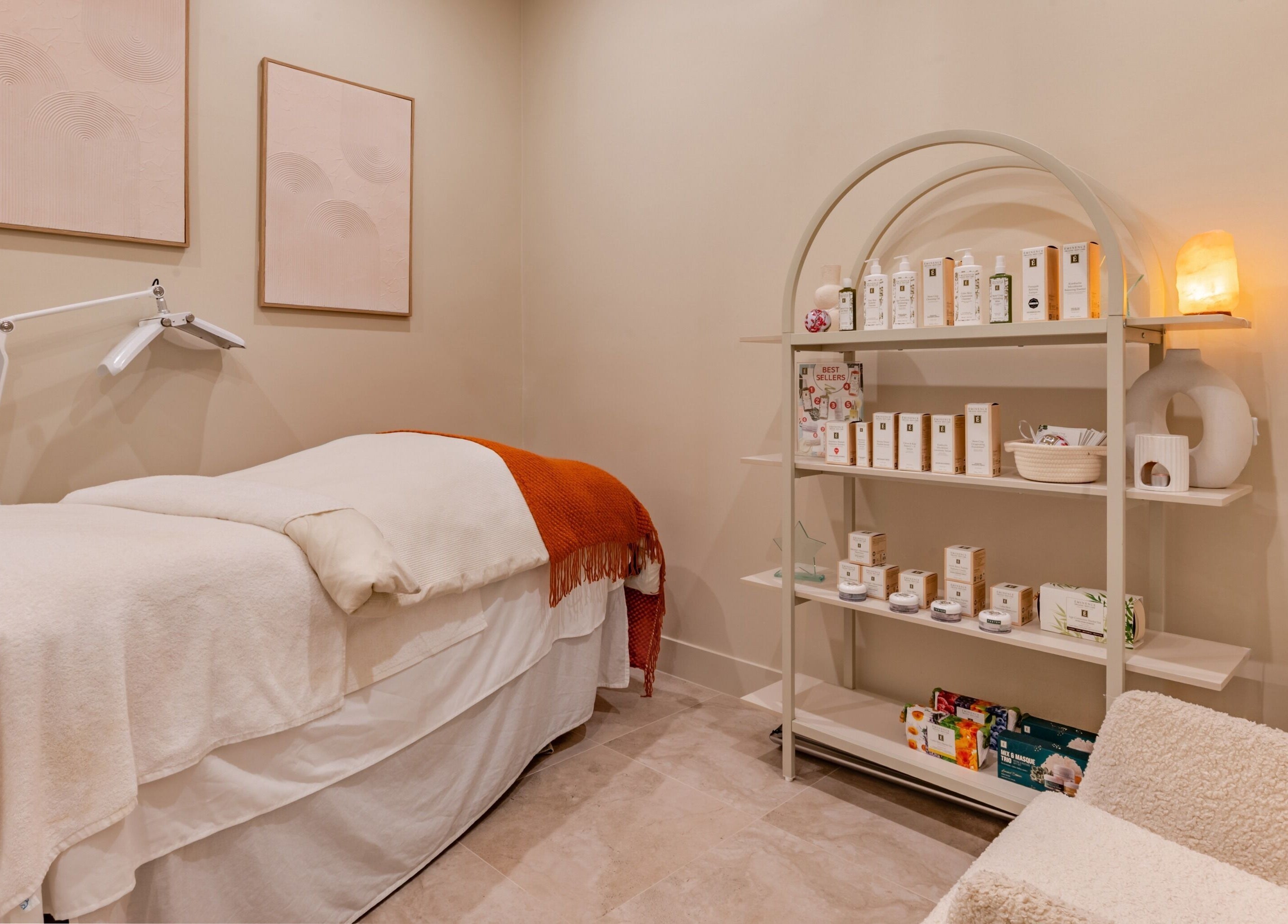 Calm treatment room at Exhale Holistic Skin, Bentleigh East, Victoria, AU, featuring a massage bed and skincare products.