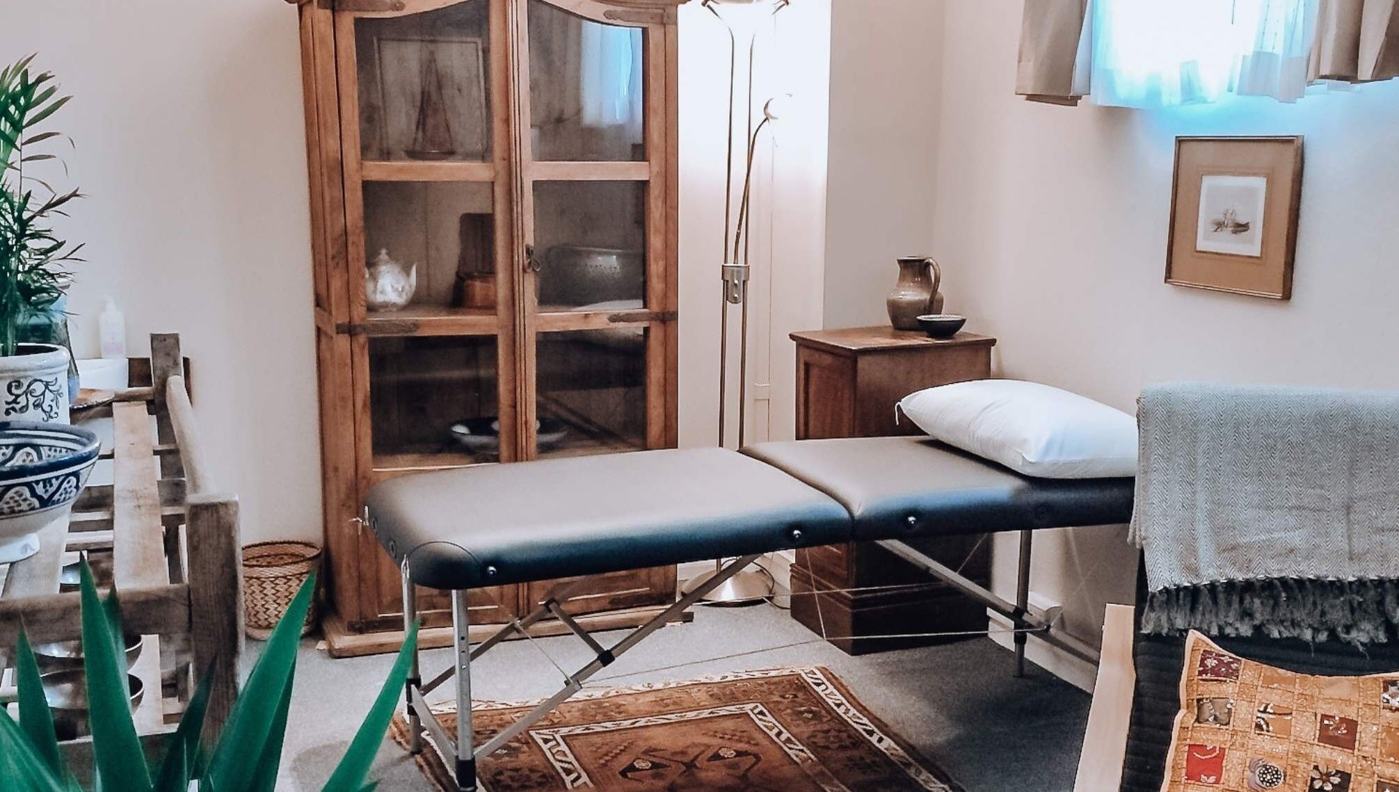 Serene treatment room at Colette Osteopathy at The Practice Rooms, Bristol, England, GB with massage table.