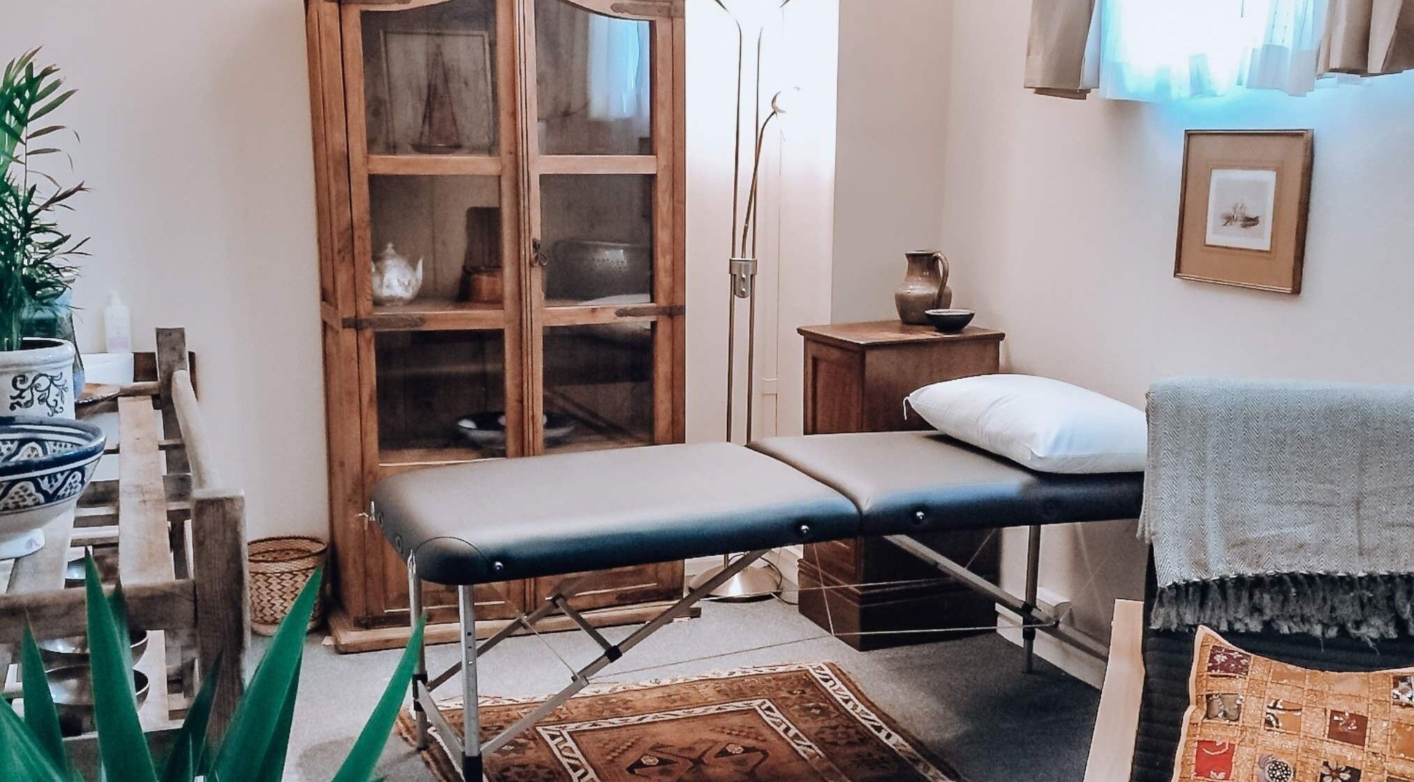 Serene treatment room at Colette Osteopathy at The Practice Rooms, Bristol, England, GB with massage table.