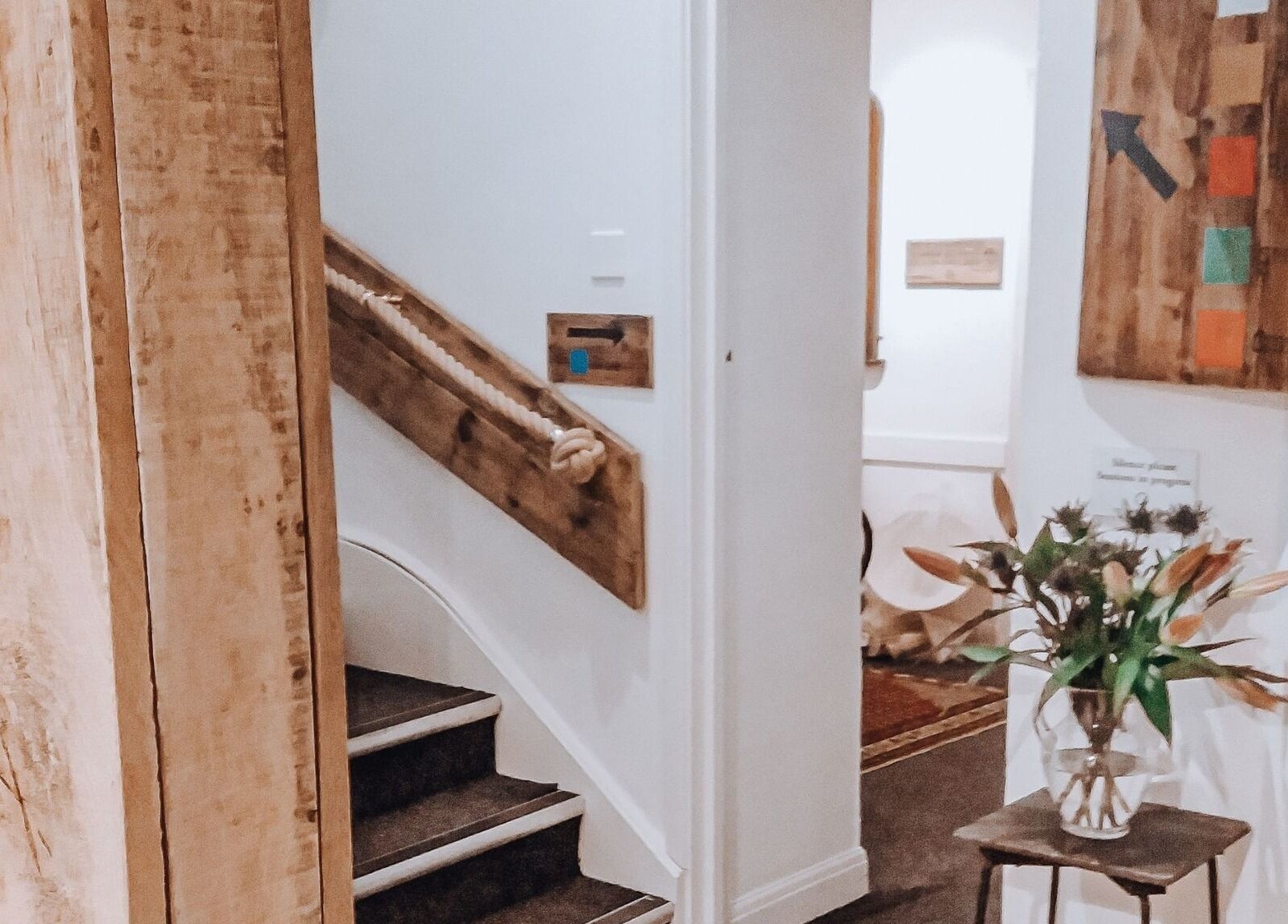 Charming interior at Colette Osteopathy at The Practice Rooms, Bristol, England, GB with wooden decor and flowers.