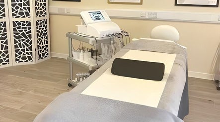Modern treatment room at Christol Beauty, Douglas, Isle of Man, GB, featuring sleek equipment and stylish decor.