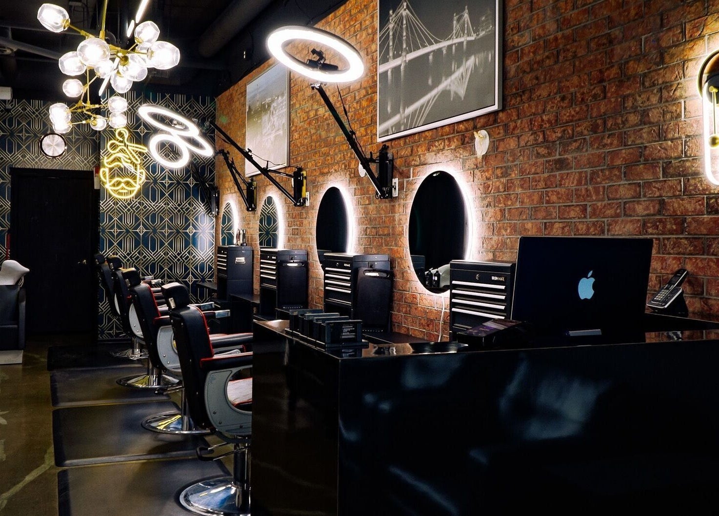 Interior of The Belmont - A Barber Collective with sleek chairs and mirrors in Calgary, Alberta, CA.
