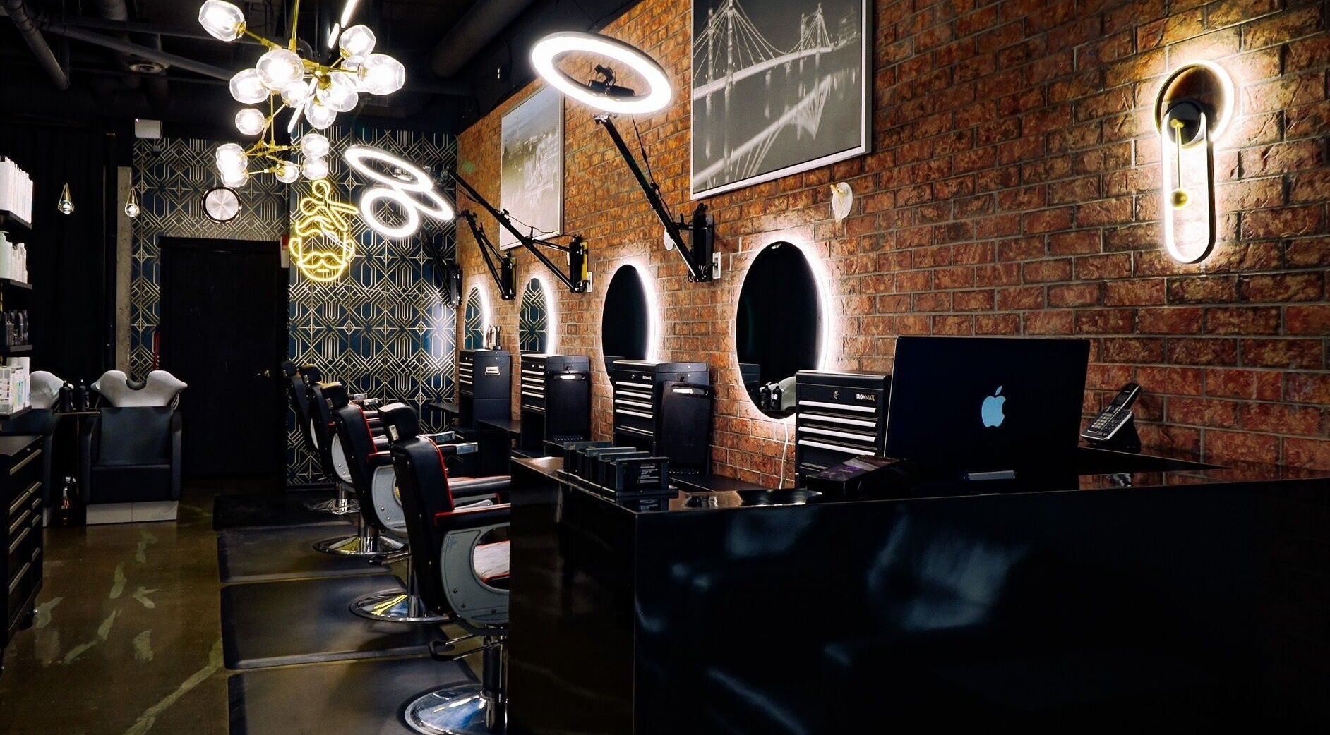 Interior of The Belmont - A Barber Collective with sleek chairs and mirrors in Calgary, Alberta, CA.