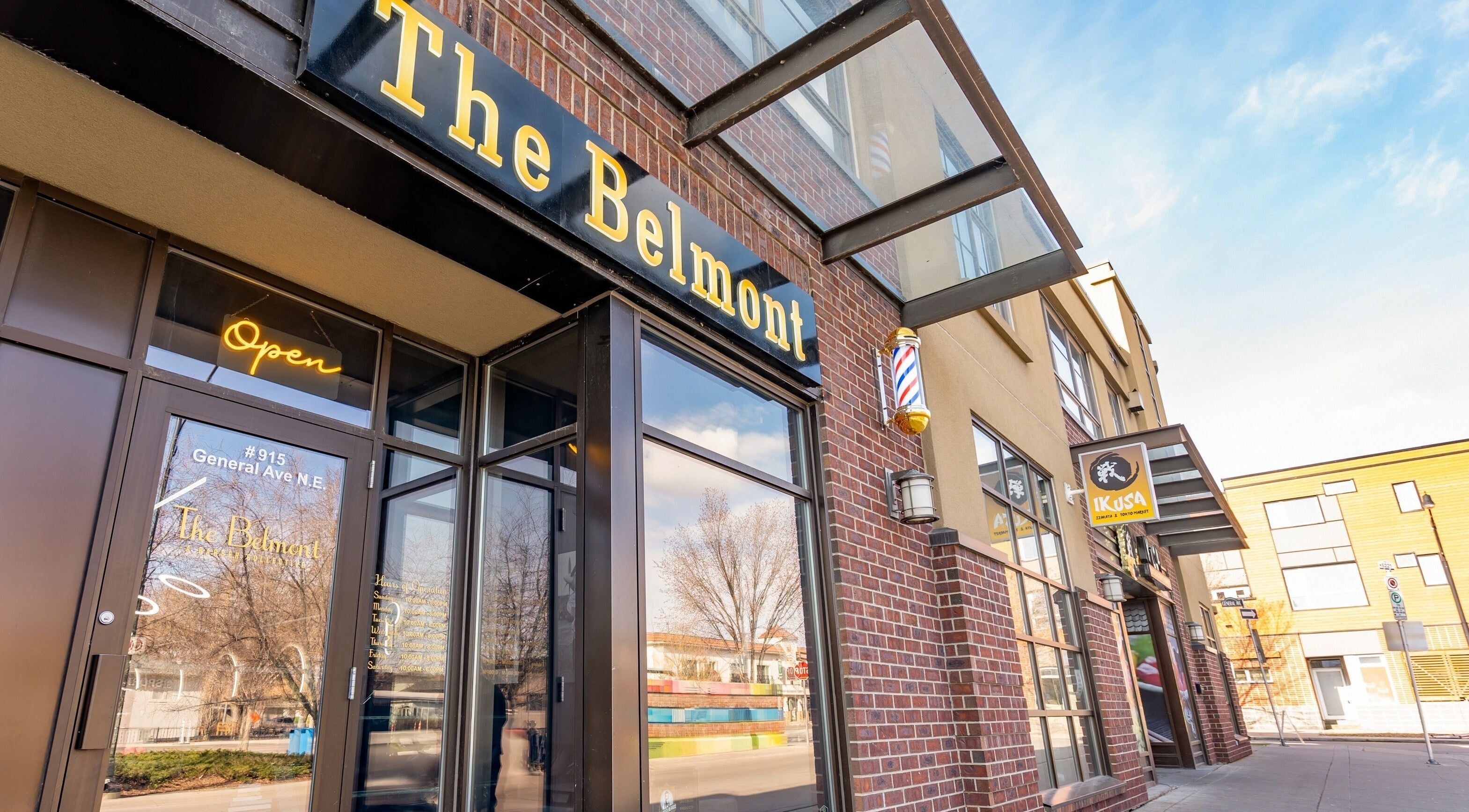 Entrance of The Belmont - A Barber Collective in Calgary, Alberta, CA, showcasing its welcoming front facade.