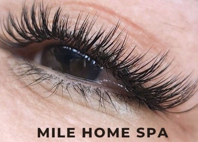 Close-up of eyelash extensions at Mile Home Spa in Abu Dhabi, AE, showcasing precise beauty care.
