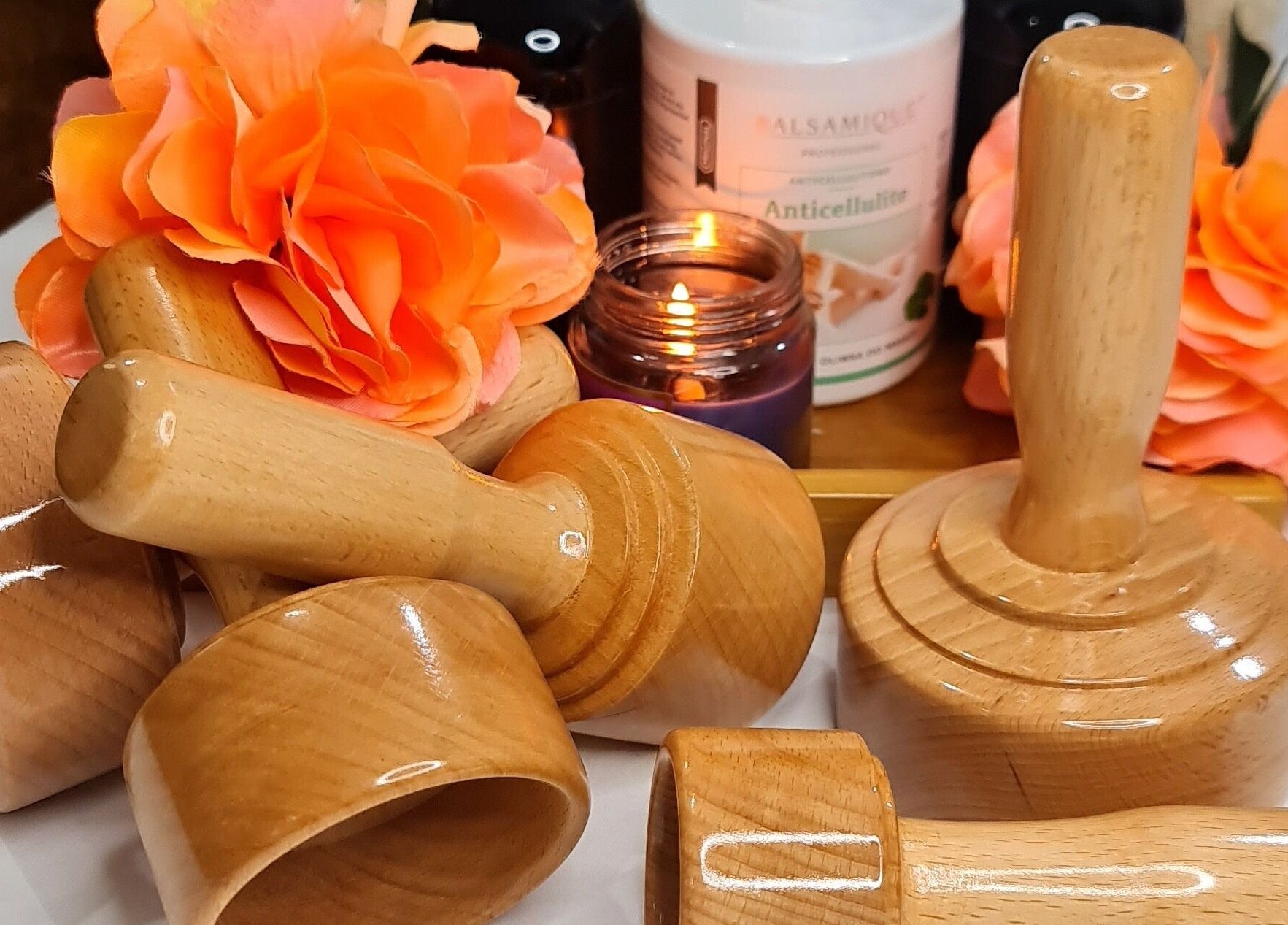 Wooden spa tools and vibrant flowers at Mile Home Spa create a serene ambience in Abu Dhabi, Abu Dhabi, AE.