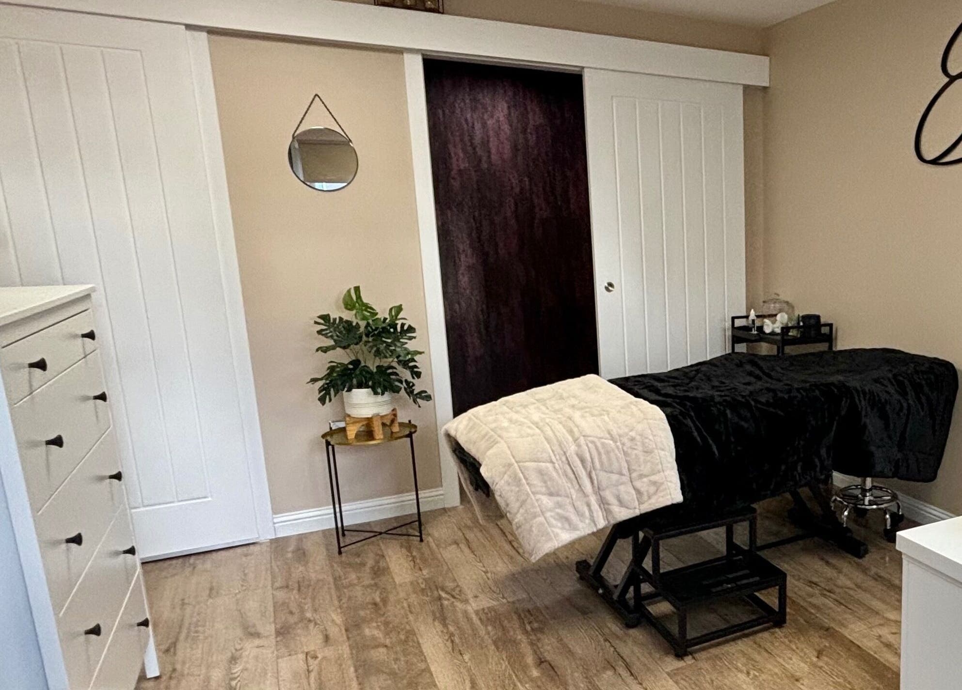 Relaxing therapy room at Elements of Beauty, Fallin, Scotland, GB, featuring cozy treatment bed.