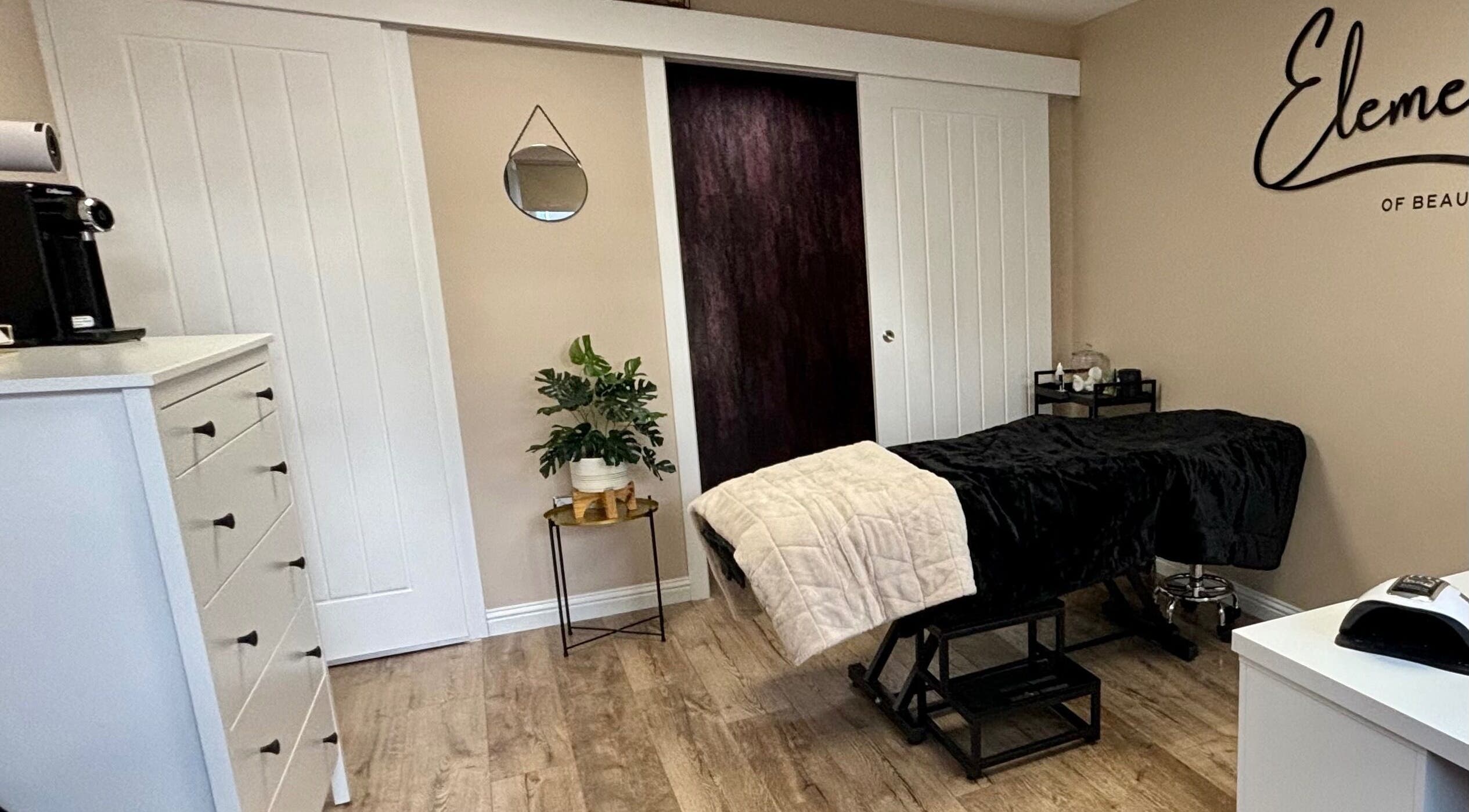 Relaxing therapy room at Elements of Beauty, Fallin, Scotland, GB, featuring cozy treatment bed.