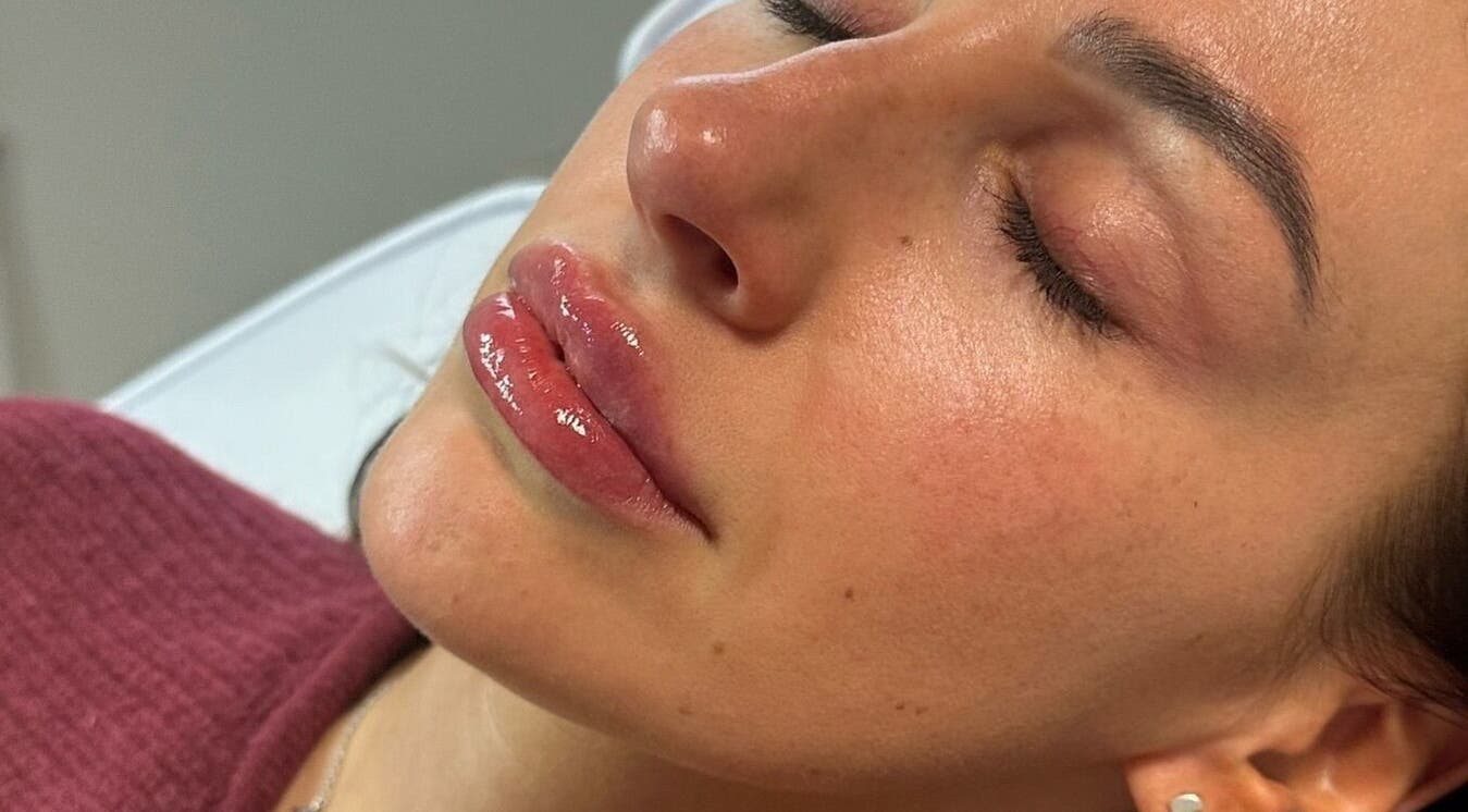 Close-up of a serene woman's face post-treatment at Clinic 01, East Kilbride, Scotland, GB.