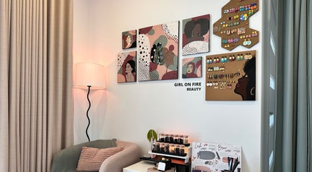 Art-filled salon wall at Girl On Fire Beauty, Taylor, AU showcases modern decor and beauty products.
