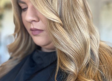 Blonde hair with soft waves styled at Refine Hair and Beauty, Plymouth, England, GB.