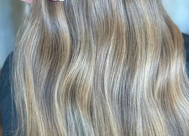 Sleek, long, wavy blonde hair at Refine Hair and Beauty, Plymouth, England, GB salon.