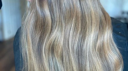 Sleek, long, wavy blonde hair at Refine Hair and Beauty, Plymouth, England, GB salon.