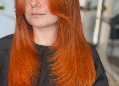 Vibrant red hairstyle at Refine Hair and Beauty, Plymouth, England, GB, showcasing expert salon artistry.