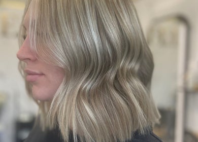 Blonde wavy hairstyle at Refine Hair and Beauty in Plymouth, England, GB. Achieve elegance and style.