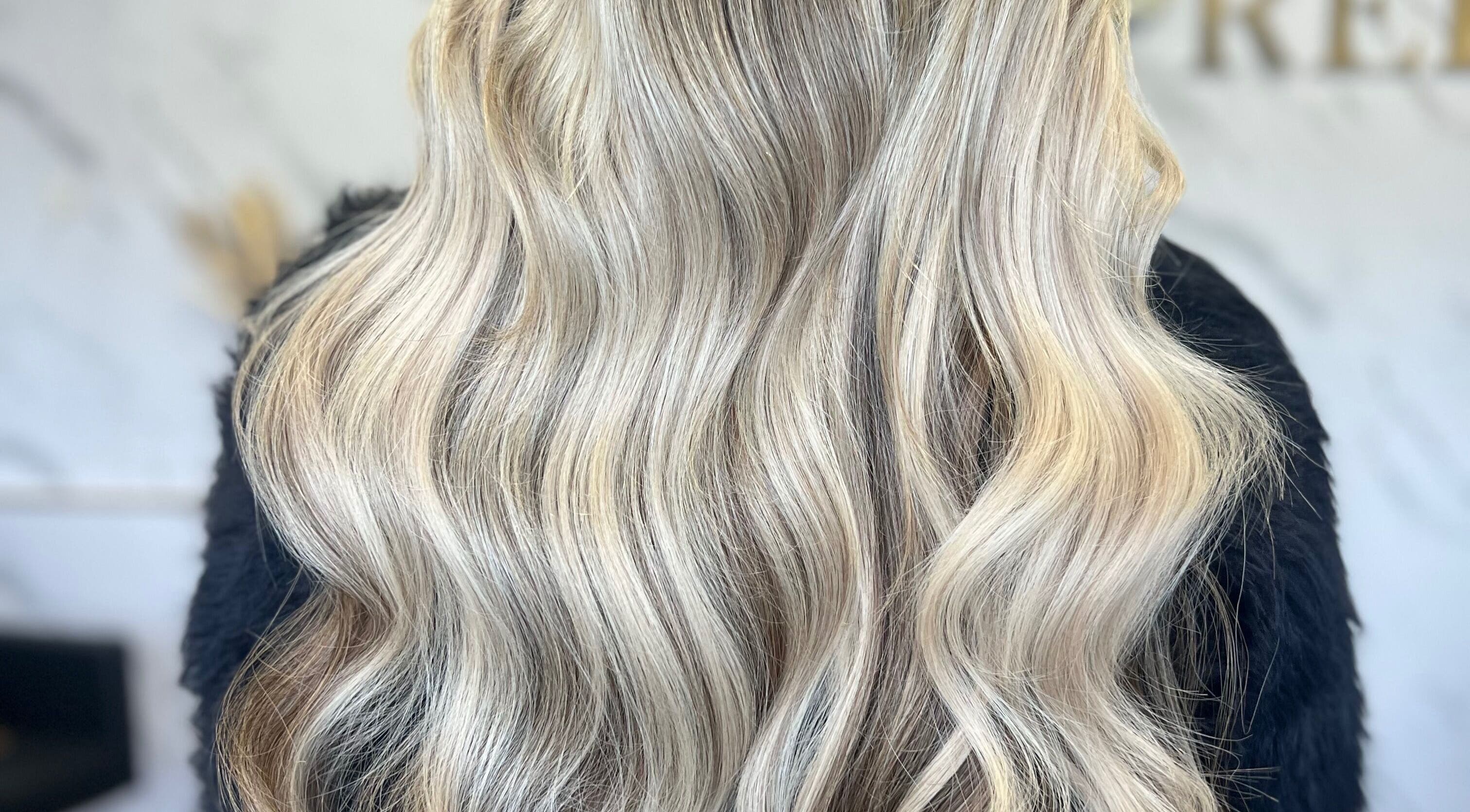 Blonde wavy hairstyle at Refine Hair and Beauty in Plymouth, England, GB.