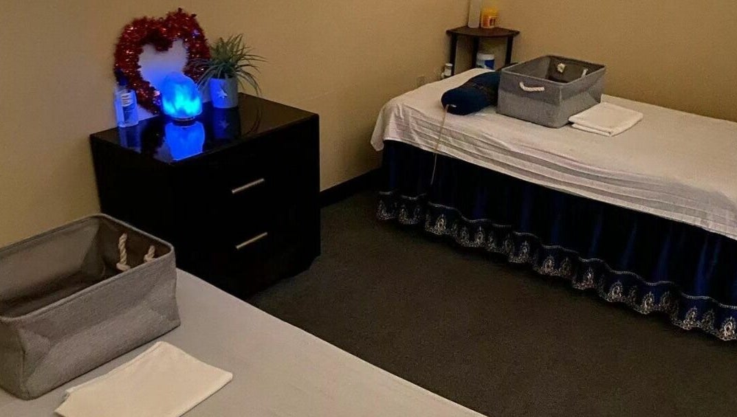 Tranquil treatment room at Z & X Foot Spa, Lutz, Florida, US with beds and calming decor.