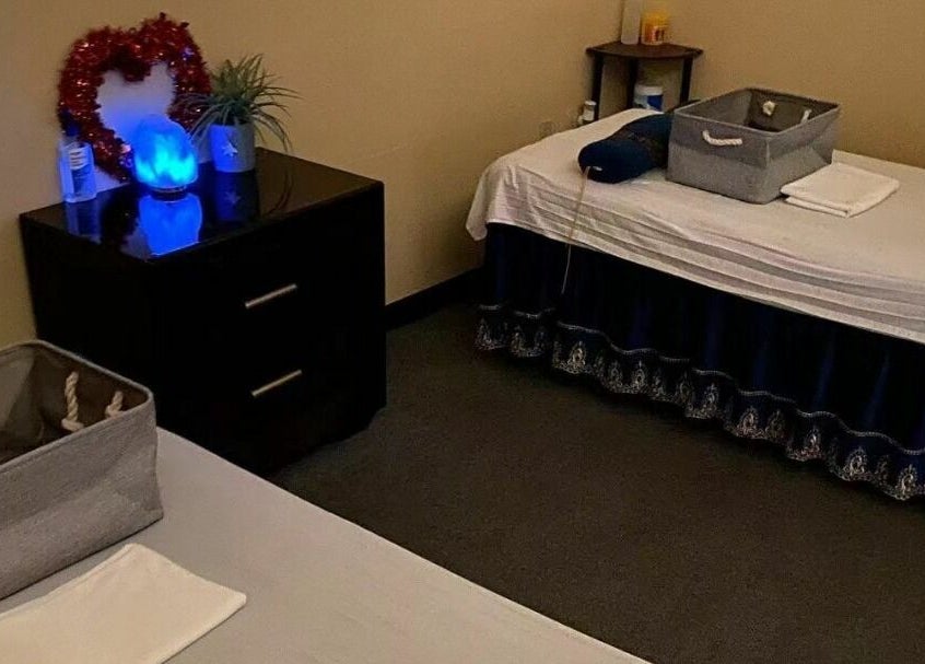 Tranquil treatment room at Z & X Foot Spa, Lutz, Florida, US with beds and calming decor.