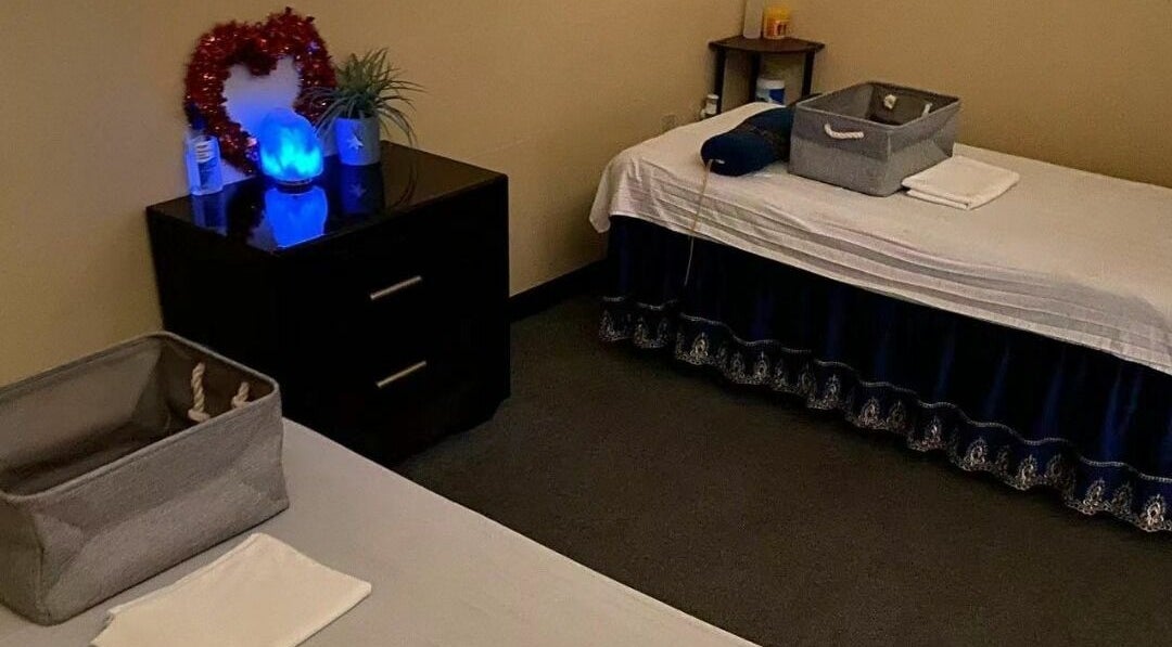 Tranquil treatment room at Z & X Foot Spa, Lutz, Florida, US with beds and calming decor.