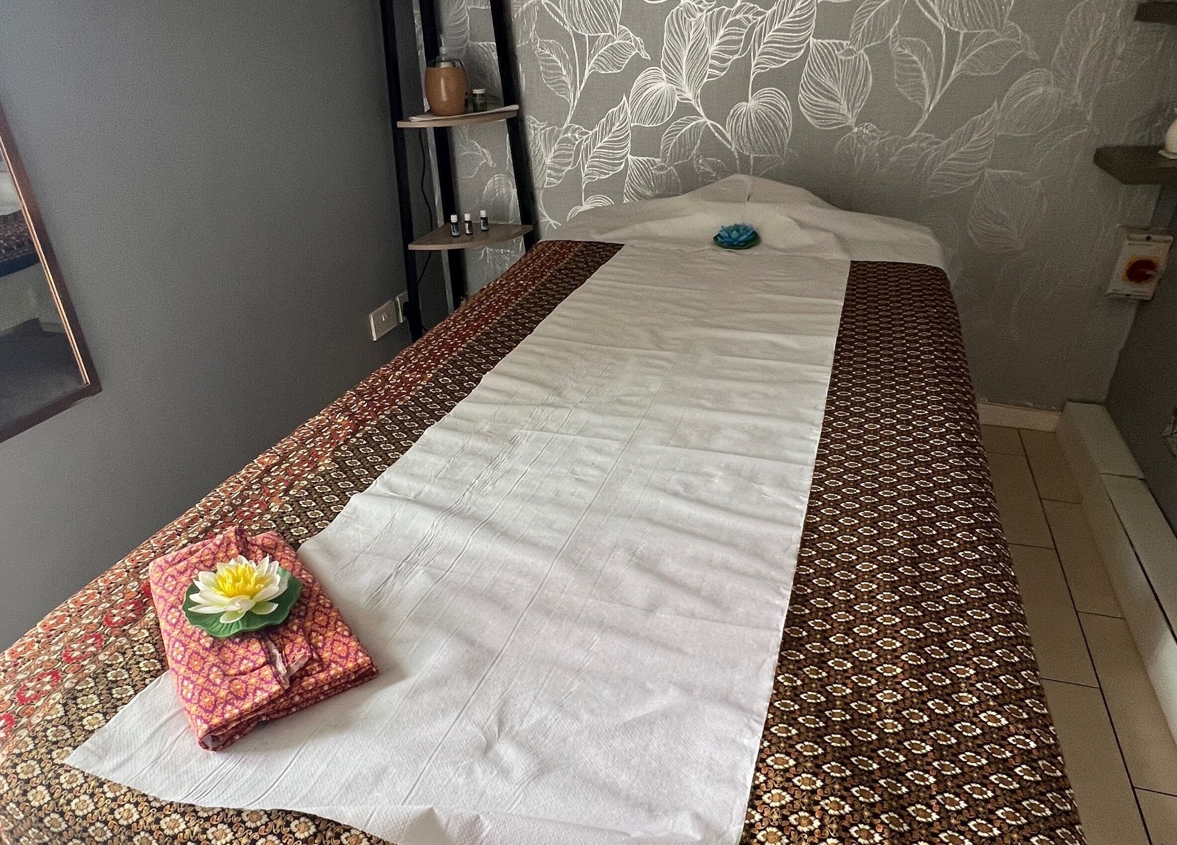 Tranquil massage room at Lanna Thai Massage & Waxing in Cardiff, Wales, GB, featuring a cozy massage bed.