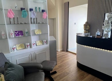 Modern reception area at Lanna Thai Massage & Waxing, Cardiff, Wales, GB with elegant decor and wellness products.