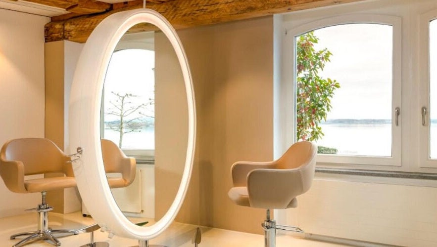 Stylish salon space at BLONDE.LAB by Caroline Rohwer — Zug, Zug, CH with scenic window view and modern design.